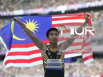 Eddy Bernard of Malaysia celebrates winning bronze in Men's 100m - T44 Final during the Paris 2024 Paralympic Games at Stade de France on Se...