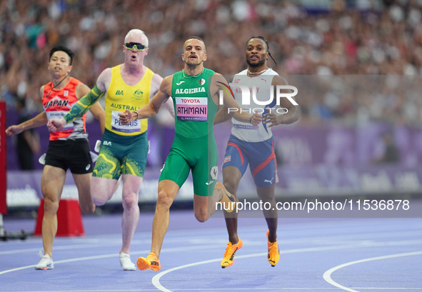 Djamil Skander Athmani of Algeria celebrates winning gold in Men's 100m - T13 Final during the Paris 2024 Paralympic Games at Stade de Franc...