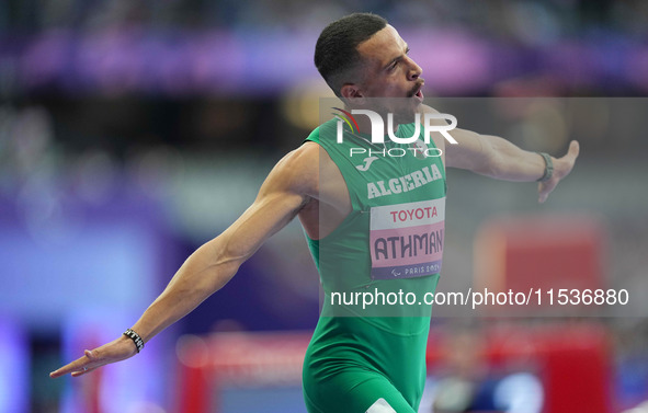 Djamil Skander Athmani of Algeria celebrates winning gold in Men's 100m - T13 Final during the Paris 2024 Paralympic Games at Stade de Franc...