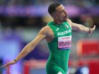 Djamil Skander Athmani of Algeria celebrates winning gold in Men's 100m - T13 Final during the Paris 2024 Paralympic Games at Stade de Franc...