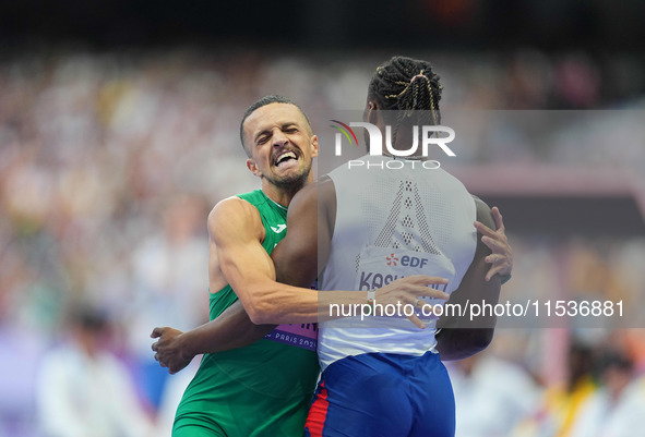 Djamil Skander Athmani of Algeria celebrates winning gold in Men's 100m - T13 Final during the Paris 2024 Paralympic Games at Stade de Franc...