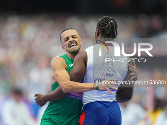 Djamil Skander Athmani of Algeria celebrates winning gold in Men's 100m - T13 Final during the Paris 2024 Paralympic Games at Stade de Franc...