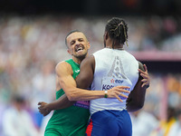 Djamil Skander Athmani of Algeria celebrates winning gold in Men's 100m - T13 Final during the Paris 2024 Paralympic Games at Stade de Franc...