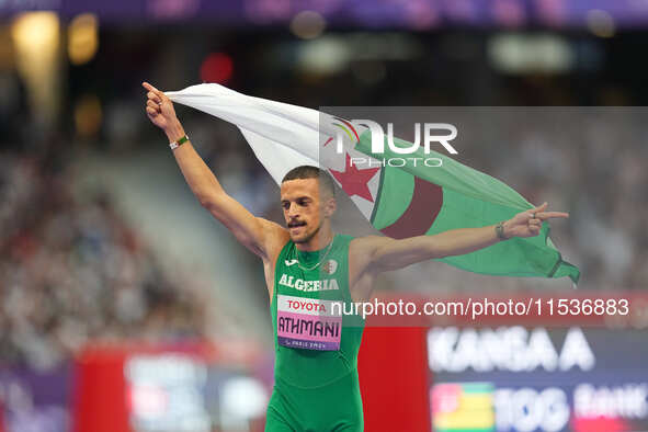 Djamil Skander Athmani of Algeria celebrates winning gold in Men's 100m - T13 Final during the Paris 2024 Paralympic Games at Stade de Franc...