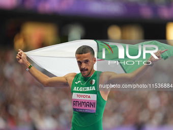 Djamil Skander Athmani of Algeria celebrates winning gold in Men's 100m - T13 Final during the Paris 2024 Paralympic Games at Stade de Franc...