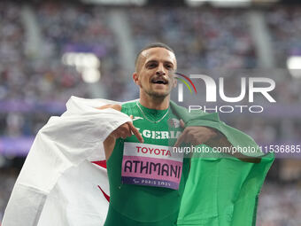 Djamil Skander Athmani of Algeria celebrates winning gold in Men's 100m - T13 Final during the Paris 2024 Paralympic Games at Stade de Franc...