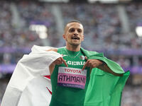 Djamil Skander Athmani of Algeria celebrates winning gold in Men's 100m - T13 Final during the Paris 2024 Paralympic Games at Stade de Franc...