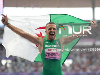 Djamil Skander Athmani of Algeria celebrates winning gold in Men's 100m - T13 Final during the Paris 2024 Paralympic Games at Stade de Franc...