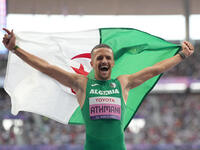 Djamil Skander Athmani of Algeria celebrates winning gold in Men's 100m - T13 Final during the Paris 2024 Paralympic Games at Stade de Franc...