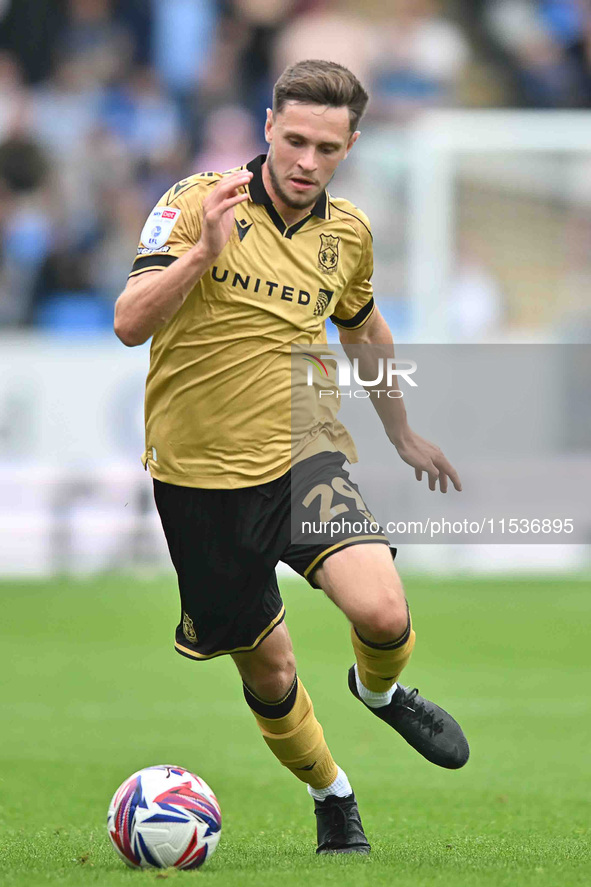 Ryan Barnett (29, Wrexham) controls the ball during the Sky Bet League 1 match between Peterborough and Wrexham in Peterborough, United King...