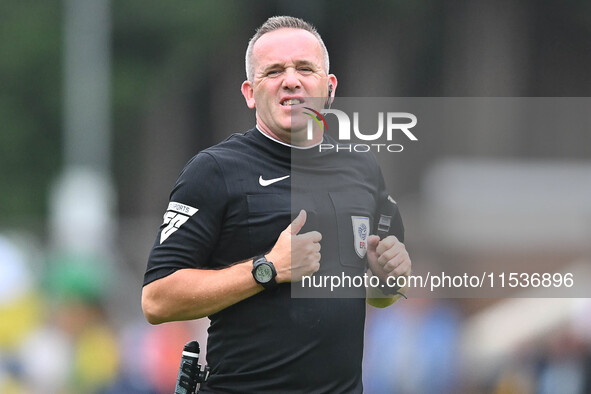 Referee Carl Brook looks on during the Sky Bet League 1 match between Peterborough and Wrexham at London Road in Peterborough, England, on A...