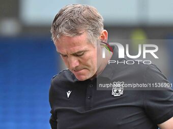 Manager Phil Parkinson looks down during the Sky Bet League 1 match between Peterborough and Wrexham at London Road in Peterborough, England...