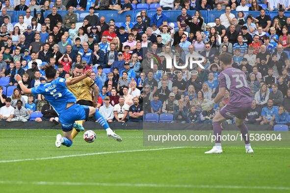 Jack Marriot (11 Wrexham) shoots and scores the first goal during the Sky Bet League 1 match between Peterborough and Wrexham at London Road...