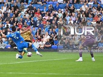 Jack Marriot (11 Wrexham) shoots and scores the first goal during the Sky Bet League 1 match between Peterborough and Wrexham at London Road...