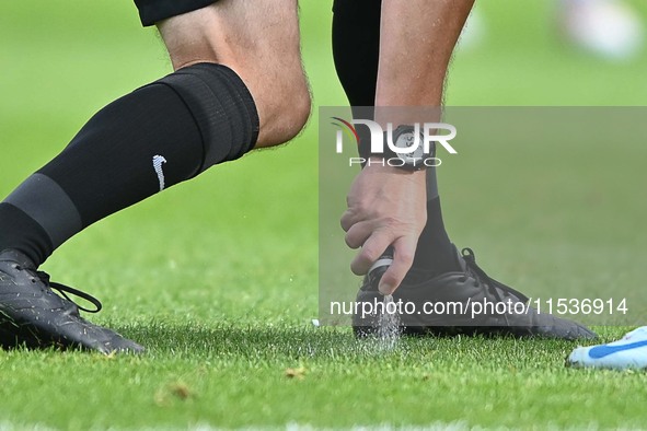 Referee Carl Brook marks the wall during the Sky Bet League 1 match between Peterborough and Wrexham in Peterborough, England, on August 31,...