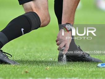 Referee Carl Brook marks the wall during the Sky Bet League 1 match between Peterborough and Wrexham in Peterborough, England, on August 31,...