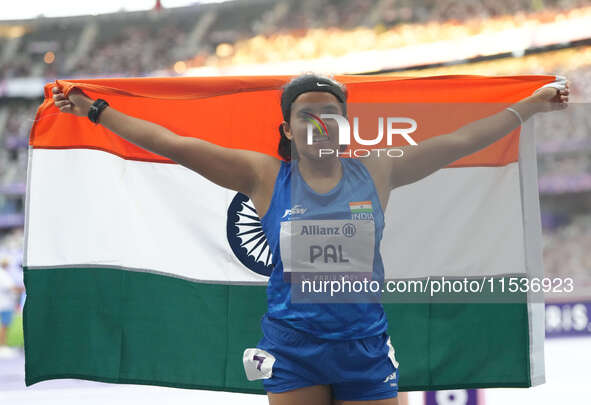 Preethi Pal of India celebrates winning bronze in Women's 200m - T35 Final during the Paris 2024 Paralympic Games at Stade de France on Sept...