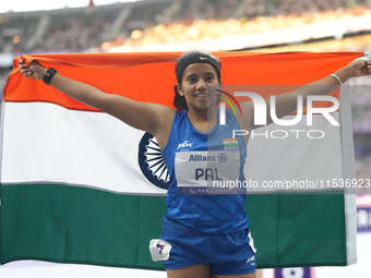 Preethi Pal of India celebrates winning bronze in Women's 200m - T35 Final during the Paris 2024 Paralympic Games at Stade de France on Sept...