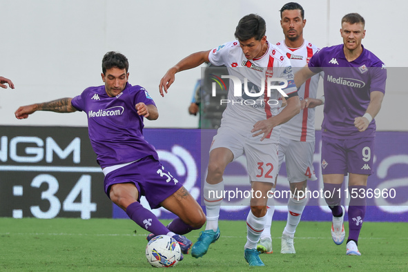 Danilo Cataldi of ACF Fiorentina and Matteo Pessina of AC Monza battle for the ball during the Italian Serie A football match between ACF Fi...