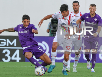 Danilo Cataldi of ACF Fiorentina and Matteo Pessina of AC Monza battle for the ball during the Italian Serie A football match between ACF Fi...