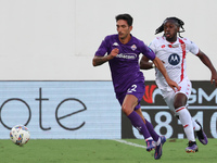 Danilo Cataldi of ACF Fiorentina and Warren Bondo of AC Monza battle for the ball during the Italian Serie A football match between ACF Fior...