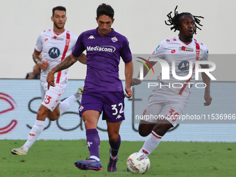 Danilo Cataldi of ACF Fiorentina and Warren Bondo of AC Monza battle for the ball during the Italian Serie A football match between ACF Fior...