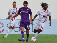 Danilo Cataldi of ACF Fiorentina and Warren Bondo of AC Monza battle for the ball during the Italian Serie A football match between ACF Fior...