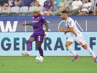 Domilson Cordeiro Dos Santos Dodo of ACF Fiorentina and Gianluca Caprari of AC Monza battle for the ball during the Italian Serie A football...