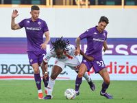 Danilo Cataldi of ACF Fiorentina and Warren Bondo of AC Monza battle for the ball during the Italian Serie A football match between ACF Fior...