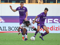 Danilo Cataldi of ACF Fiorentina and Warren Bondo of AC Monza battle for the ball during the Italian Serie A football match between ACF Fior...