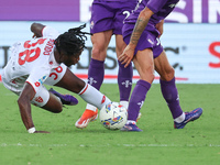 Danilo Cataldi of ACF Fiorentina and Warren Bondo of AC Monza battle for the ball during the Italian Serie A football match between ACF Fior...