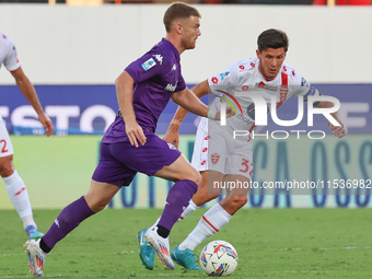 Lucas Beltran of ACF Fiorentina and Matteo Pessina of AC Monza battle for the ball during the Italian Serie A football match between ACF Fio...