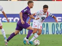 Lucas Beltran of ACF Fiorentina and Matteo Pessina of AC Monza battle for the ball during the Italian Serie A football match between ACF Fio...