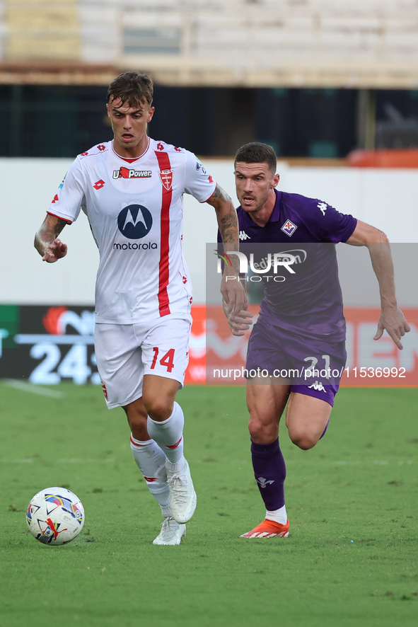 Robin Gosens of ACF Fiorentina and Daniel Maldini of AC Monza battle for the ball during the Italian Serie A football match between ACF Fior...