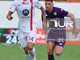 Robin Gosens of ACF Fiorentina and Daniel Maldini of AC Monza battle for the ball during the Italian Serie A football match between ACF Fior...