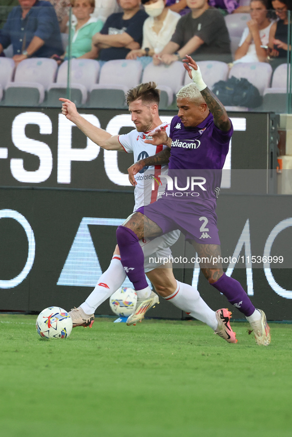 Domilson Cordeiro Dos Santos Dodo of ACF Fiorentina and Georgios Kyriakopoulos of AC Monza battle for the ball during the Italian Serie A fo...