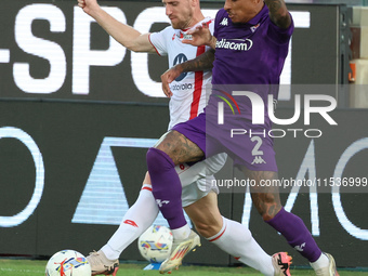 Domilson Cordeiro Dos Santos Dodo of ACF Fiorentina and Georgios Kyriakopoulos of AC Monza battle for the ball during the Italian Serie A fo...