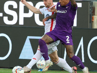 Domilson Cordeiro Dos Santos Dodo of ACF Fiorentina and Georgios Kyriakopoulos of AC Monza battle for the ball during the Italian Serie A fo...