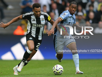 Newcastle United's Jacob Murphy breaks away from Tottenham Hotspur's Wilson Odobert during the Premier League match between Newcastle United...