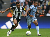 Newcastle United's Jacob Murphy breaks away from Tottenham Hotspur's Wilson Odobert during the Premier League match between Newcastle United...