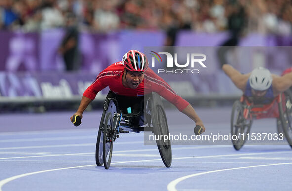 Pongsakorn Paeyo of Thailand celebrates winning gold in Men's 400m - T53 Final during the Paris 2024 Paralympic Games at Stade de France on...