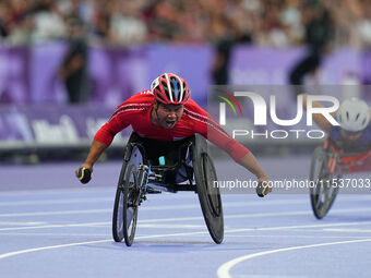 Pongsakorn Paeyo of Thailand celebrates winning gold in Men's 400m - T53 Final during the Paris 2024 Paralympic Games at Stade de France on...