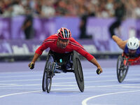 Pongsakorn Paeyo of Thailand celebrates winning gold in Men's 400m - T53 Final during the Paris 2024 Paralympic Games at Stade de France on...