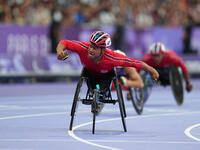 Pongsakorn Paeyo of Thailand celebrates winning gold in Men's 400m - T53 Final during the Paris 2024 Paralympic Games at Stade de France on...