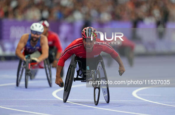 Pongsakorn Paeyo of Thailand celebrates winning gold in Men's 400m - T53 Final during the Paris 2024 Paralympic Games at Stade de France on...