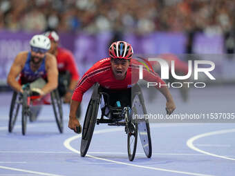 Pongsakorn Paeyo of Thailand celebrates winning gold in Men's 400m - T53 Final during the Paris 2024 Paralympic Games at Stade de France on...