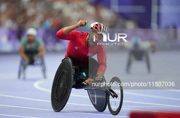 Pongsakorn Paeyo of Thailand celebrates winning gold in Men's 400m - T53 Final during the Paris 2024 Paralympic Games at Stade de France on...