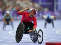 Pongsakorn Paeyo of Thailand celebrates winning gold in Men's 400m - T53 Final during the Paris 2024 Paralympic Games at Stade de France on...