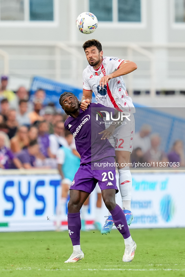 Pablo Mari' of AC Monza and Moise Kean of ACF Fiorentina jump for the ball during the Serie A Enilive match between ACF Fiorentina and AC Mo...