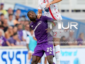 Pablo Mari' of AC Monza and Moise Kean of ACF Fiorentina jump for the ball during the Serie A Enilive match between ACF Fiorentina and AC Mo...